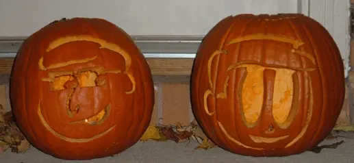 Pumpkin carvings of the Kevin and Al characters from The MSPaint Comic webcomic